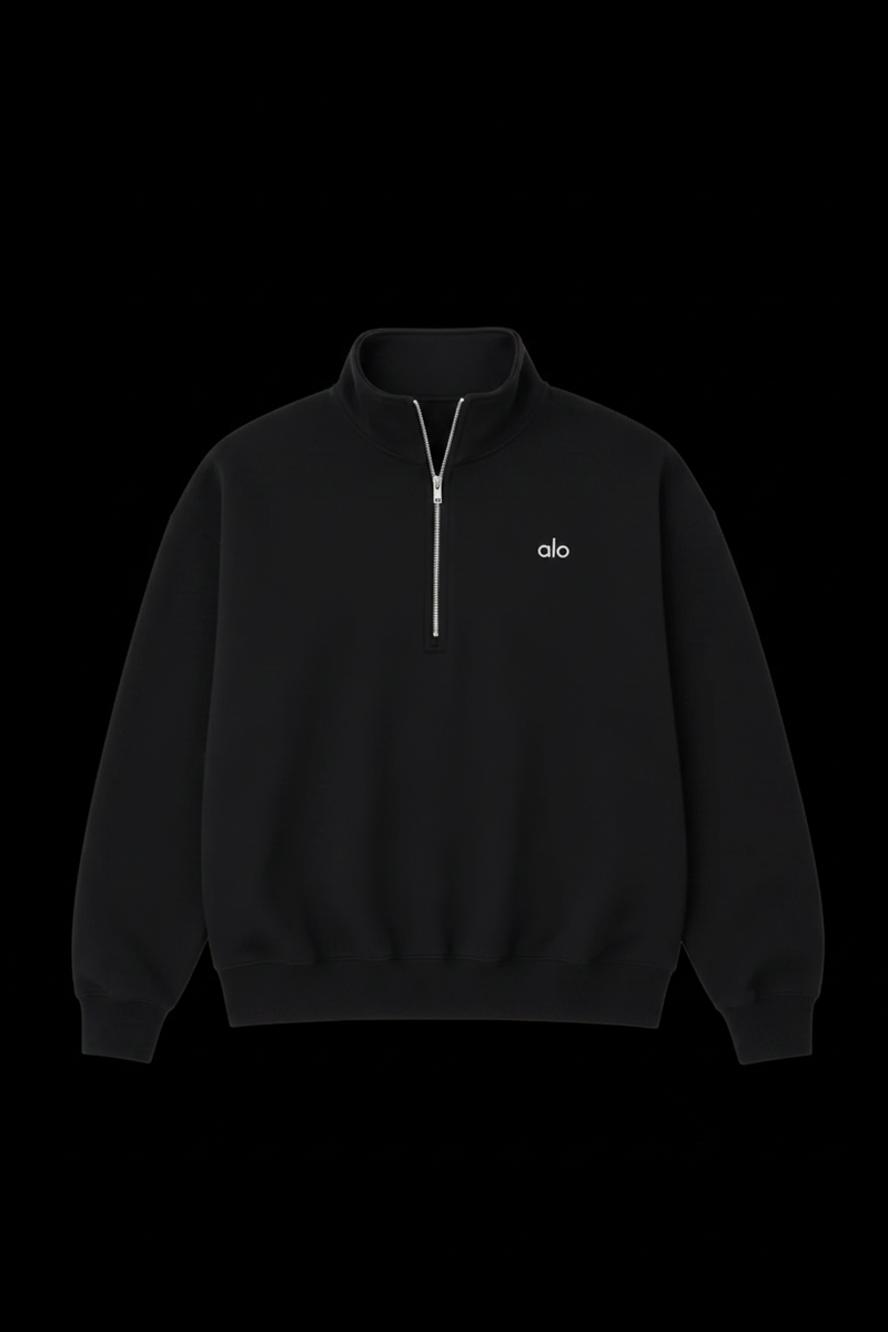 Alo black quarter-zip on black background